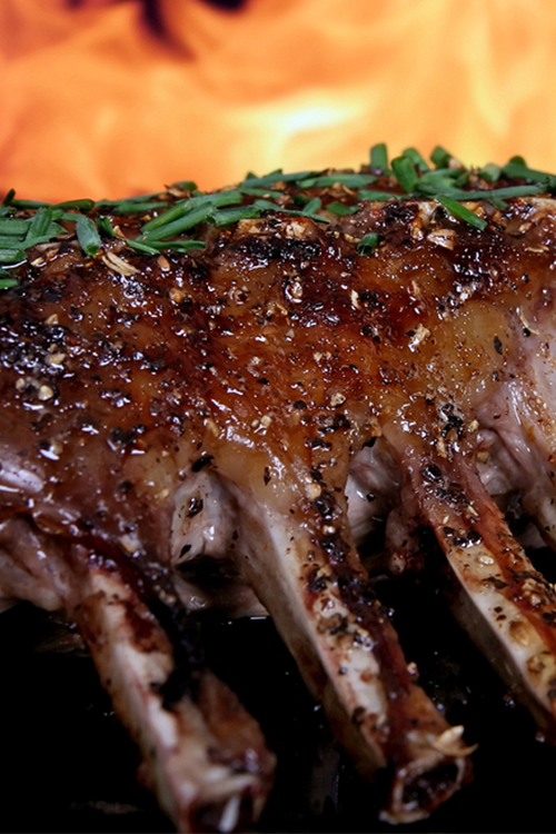 Image shows a rack of ribs being cooked